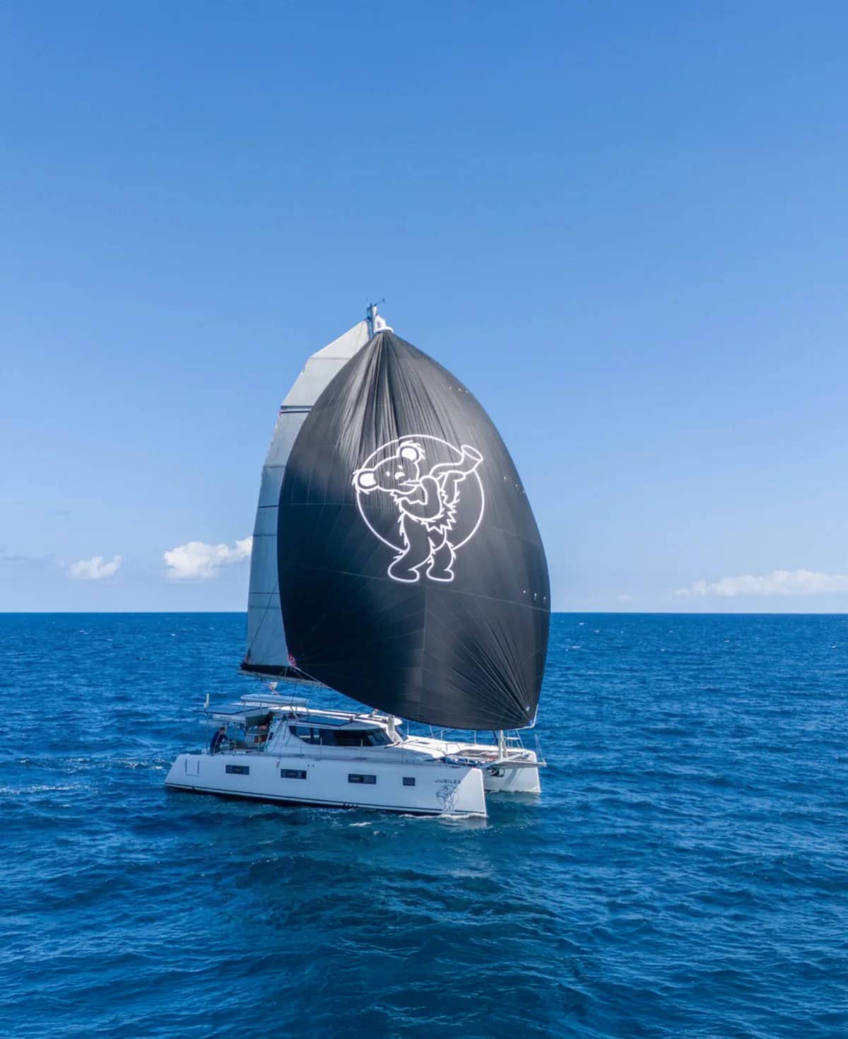 Vision 444 Jubilee sailing under a dark spinnaker